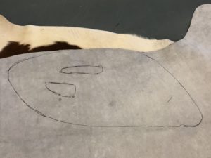 Shape of old upholstery on the back of the cowhide